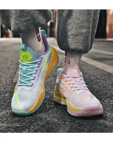 Close-up of vibrant asymmetrical color basketball shoes with breathable mesh texture.