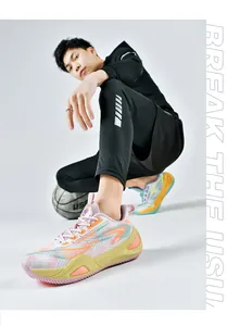 Men's breathable mesh basketball shoes worn by a model in a sports setting