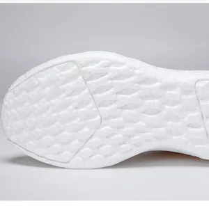 Close-up of the non-slip white textured outsole of a lightweight women's running shoe