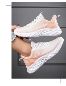 Close-up of pink breathable mesh running shoes with white honeycomb sole