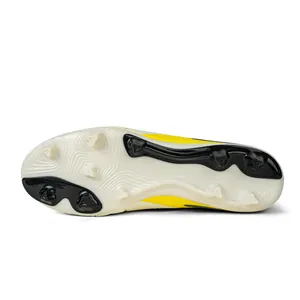 Detailed bottom view of professional soccer cleats with durable traction studs for FG HG