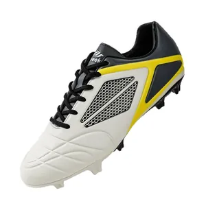 Professional white and yellow soccer shoes with FG studs for training and match play