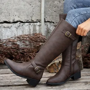 Women's brown knee-high boots with chunky heels and buckle details