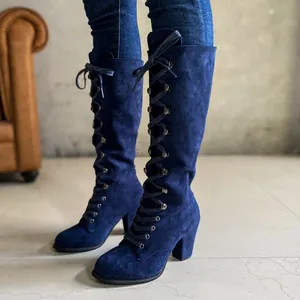 Stylish women's navy blue suede knee-high boots with chunky heels and lace-up design