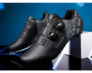 Close-up of professional black cycling shoes featuring dual rotary buckles and Tylenols logo
