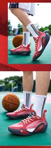 Detailed view of red 8506 basketball shoes on court with non-slip sole and low-top design