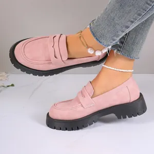 Pink suede platform penny loafers shown on feet with stylish pearl anklet accessories