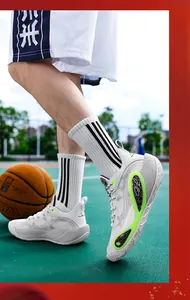 Professional low-top white basketball shoes with neon green accents for court training