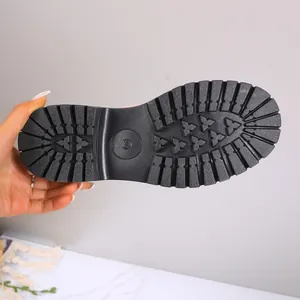 Close-up detail of the durable black rubber sole on women's British style low heel loafers.