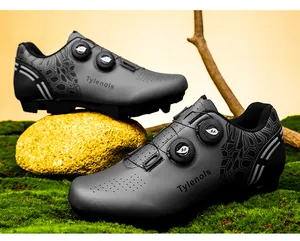 Professional T125 mountain cycling shoes featuring dual rotary buckles on mossy rock