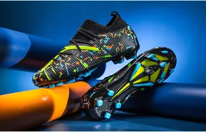 Detailed view of professional men's football cleats with colorful graffiti pattern spikes