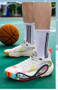 Close-up side view of professional colorful low-top basketball training shoes on court