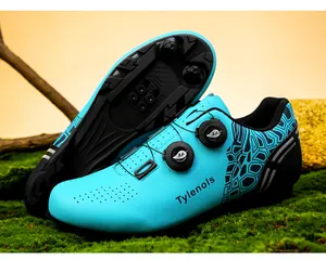 Close-up of cyan cycling shoes featuring dual rotary buckles on a natural moss background.