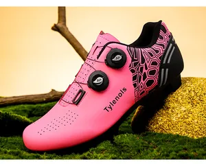 Detailed side view of professional pink cycling shoe featuring a dual dial closure system
