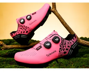 Vibrant pink cycling shoes featuring a dual rotating buckle closure and geometric patterns.
