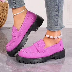 Stylish purple suede loafers with chunky black lug soles for women's autumn fashion