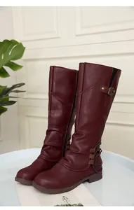 Detailed view of burgundy women's tall riding boots with side zipper and buckle strap