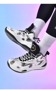 Professional close-up of low-top basketball shoes with geometric pattern on model's feet