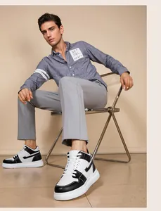Close-up of stylish black and white platform sneakers for men, casual leather board shoes