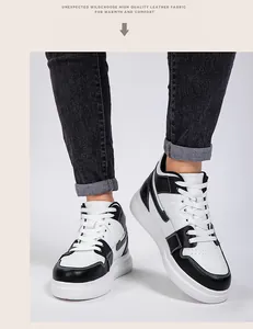 Classic black and white platform sneakers with leather finish on model