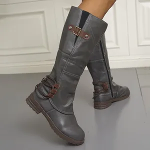 Women's gray faux leather knee-high rider boots with buckle detail and side zipper