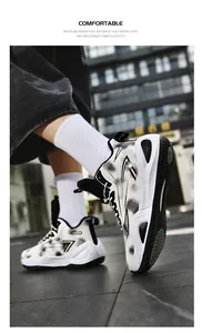 Action shot of 906 basketball shoes with striking black and white geometric patterns.