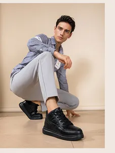 Man wearing black platform sneakers with hidden heightening and a stylish leather finish