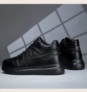 Detail view of all-black platform sneakers with textured leather finish and lace-up design