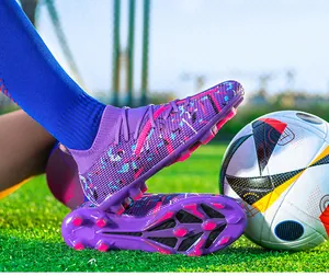 Detailed view of professional purple soccer cleats with knit sock and HG sole pattern