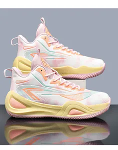 Close-up of low-top basketball shoes featuring a vibrant pink and yellow contrast colorway.