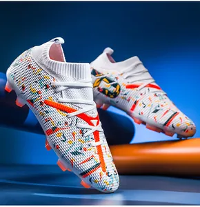 Detailed side view of white soccer cleats with colorful splash patterns and long studs.