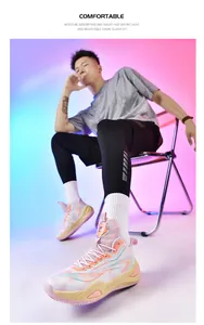 Fashionable low-top mismatched basketball shoes shown on male model in studio