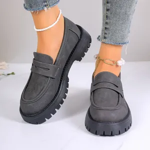 Elegant grey suede chunky loafers featuring a thick platform sole and British style