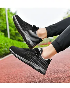 Detailed outdoor lifestyle view of breathable black fly-knit walking shoes on a track