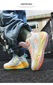 Detailed action shot of low-top mismatched basketball shoes in vibrant pink and green tones