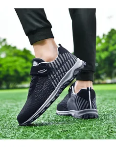 Comfortable black flyknit walking shoes with grey striped pattern for outdoor sport.