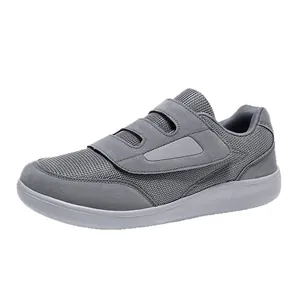 Grey breathable mesh walking shoes with Velcro straps for seniors and casual wear.