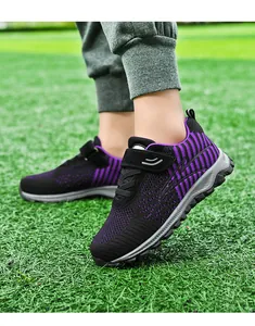 Detailed side view of breathable black and purple mesh walking shoes for seniors