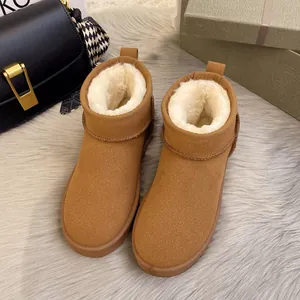 Premium brown winter snow boots with warm white faux fur lining shown on a soft grey rug