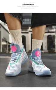 Detail of asymmetrical low-top basketball shoes with dynamic patterns worn in street style