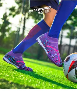 Detailed macro view of purple knitted soccer shoes with vibrant patterns on turf grass