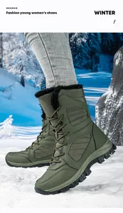 Close-up of olive green waterproof women's snow boots in a winter outdoor setting
