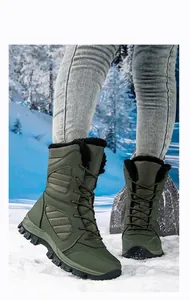 Women's high-top olive green waterproof snow boots in a snowy outdoor winter setting
