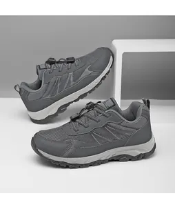 Side view of grey mesh walking shoes with quick-lace system and durable rubber sole