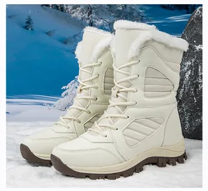Side view of women's off-white waterproof snow boots with warm fur lining and thick soles.