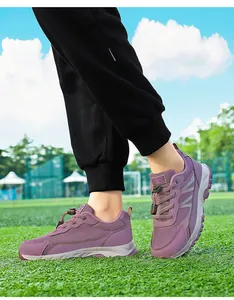 Close-up detail of purple breathable mesh walking shoes for outdoor sports and travel.
