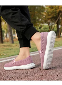 Close-up of purple breathable flyknit slip-on walking shoes for outdoor sports and leisure