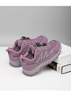Close-up detail of purple breathable mesh walking shoes featuring quick lace system.