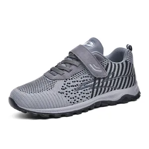 Breathable grey fly-knit walking shoes for men and women with mesh upper and velcro strap
