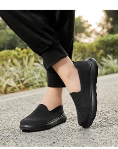 Close-up of breathable black knit mesh slip-on walking shoes for men and women